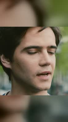 Close-up of a young man's face with his eyes closed